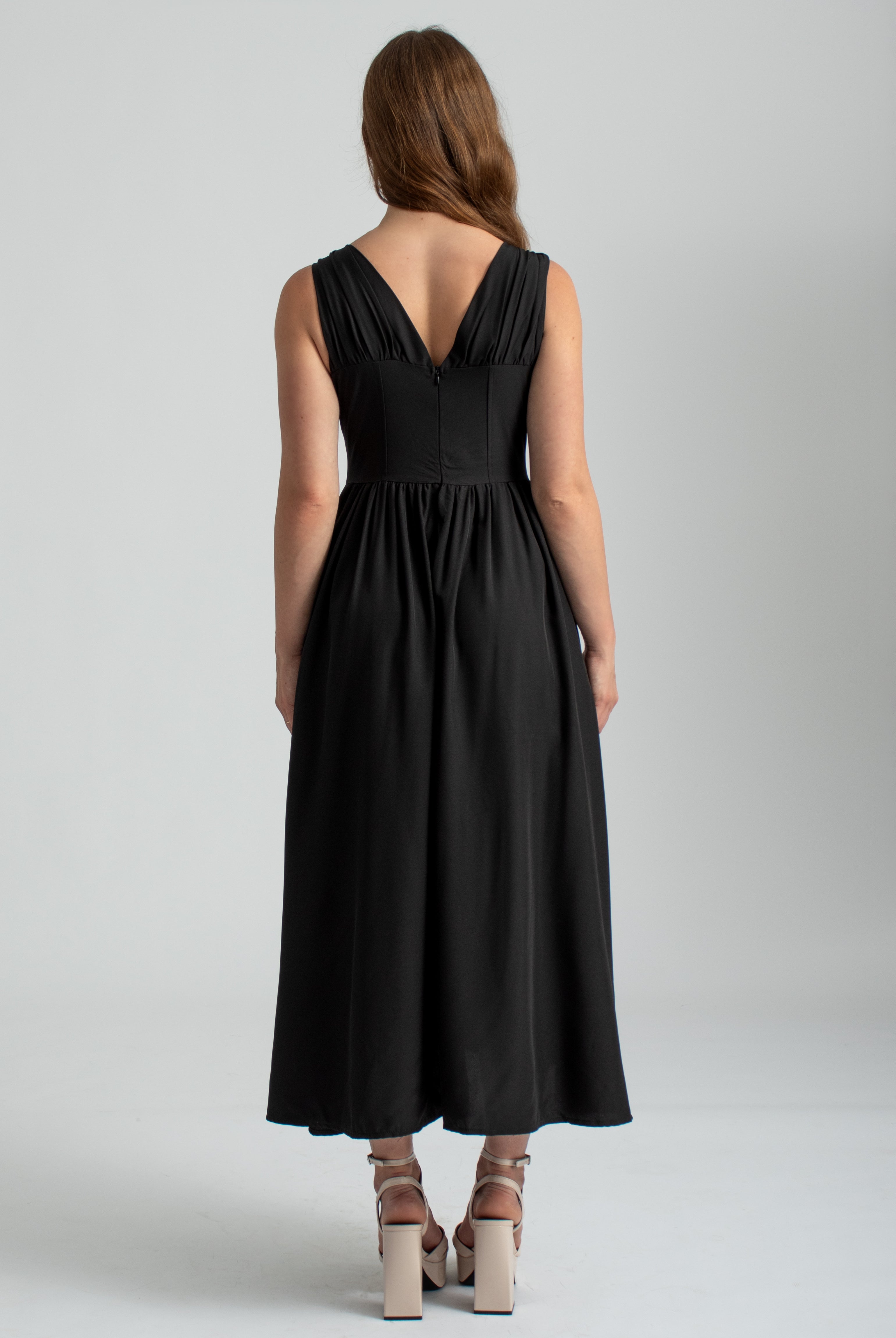 zwarte midi zomer jurk met zakken, lage hals en corset lijfje