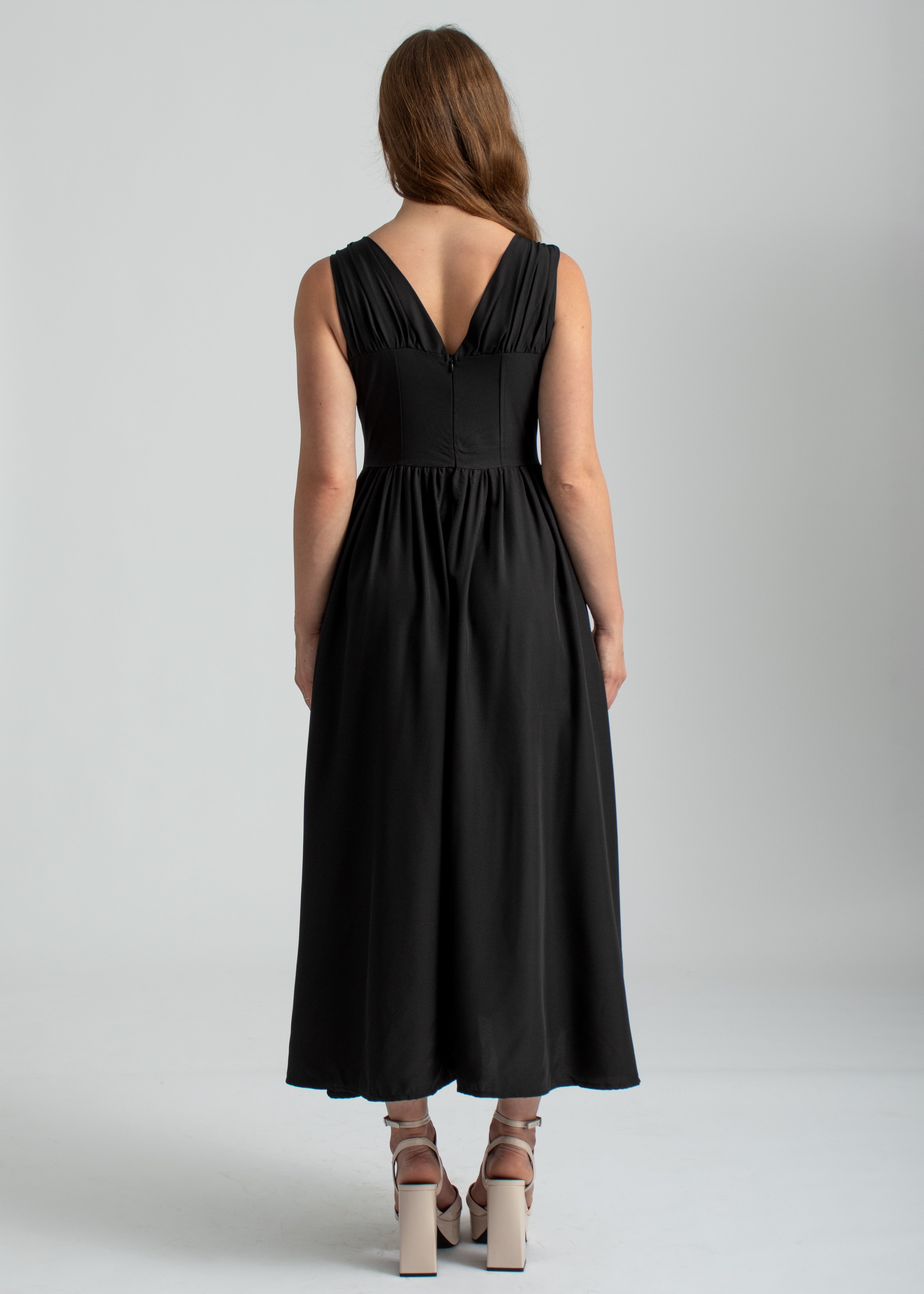 zwarte midi zomer jurk met zakken, lage hals en corset lijfje