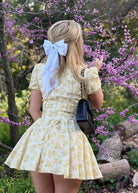 Gele bloemenprint jurk v hals mini