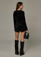 zwarte lange mouwen jumpsuit met v-hals en sequins 