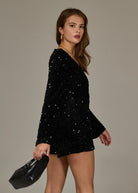 zwarte lange mouwen jumpsuit met v-hals en sequins 